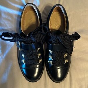 The office of Angela Scott Mr Logan black shoes
